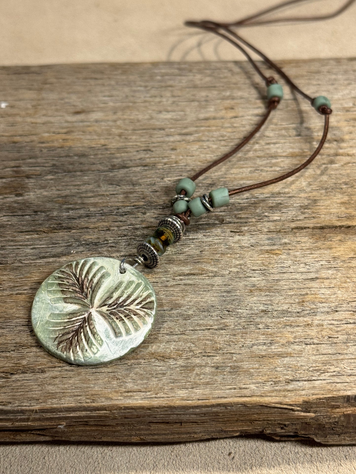 Leather Cord Necklace w/botanical clay charm